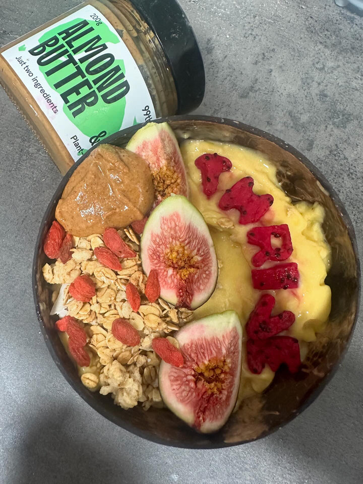 Thrive with Every Bite: A Tropical Smoothie Bowl Powered by 99th Monkey's Salted Almond Butter